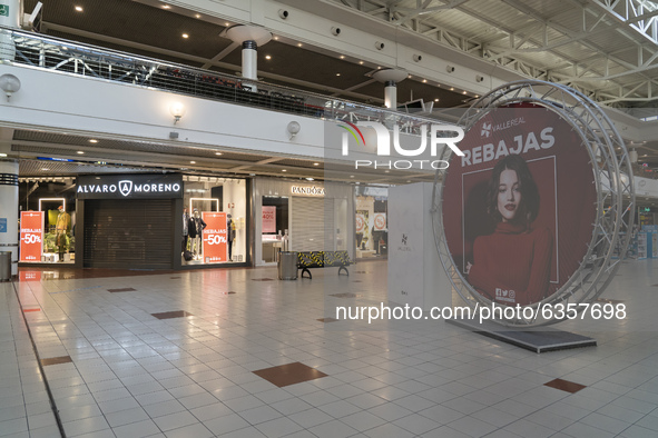 A poster announces the sales at the Valle Real Shopping Center in Santander, Spain on January 16, 2021 that remains with the stores closed d...