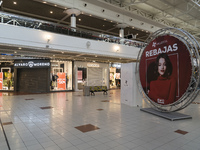 A poster announces the sales at the Valle Real Shopping Center in Santander, Spain on January 16, 2021 that remains with the stores closed d...