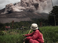 Farmers observe volcanic activity continued to emit Sinabung spews ash and volcanic material after following the increase in the alert level...