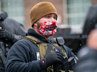 A member of the Ohio Boogaloo Bois prepares to march during an armed protest at the Ohio Statehouse ahead of the inauguration of President-e...