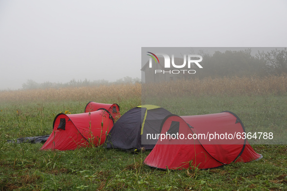 Tents in which refugees slept over the night are seen in a field close to the Serbia-Croatia border, between Berkasovo and Bapska on Septemb...