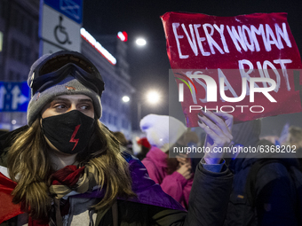 People take part in a demonstration against the abortion ban law, in Warsaw, Poland, on January 20, 2021. (