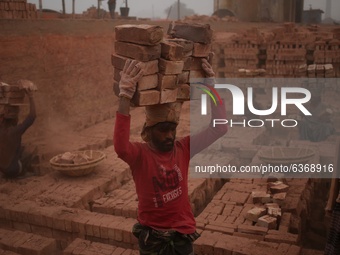 Migrant worker during work at a  brick making field in Dhaka, Bangladesh on Thursday , January 21, 2021.  (
