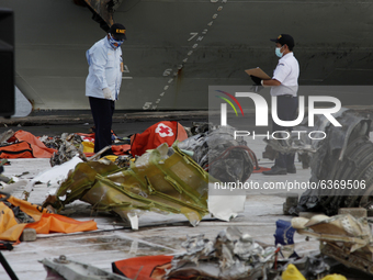 Members of Indonesian National Transportation Safety Commite checking the wreckages of crashed Sriwijaya Air flight SJ182 on the last day of...