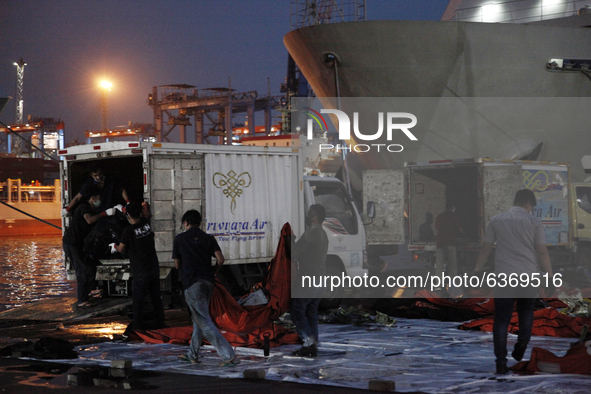 Joint SAR officers load the wreckages of crashed Sriwijaya Air flight SJ182 into the truck to be transport to National Transportation Safety...