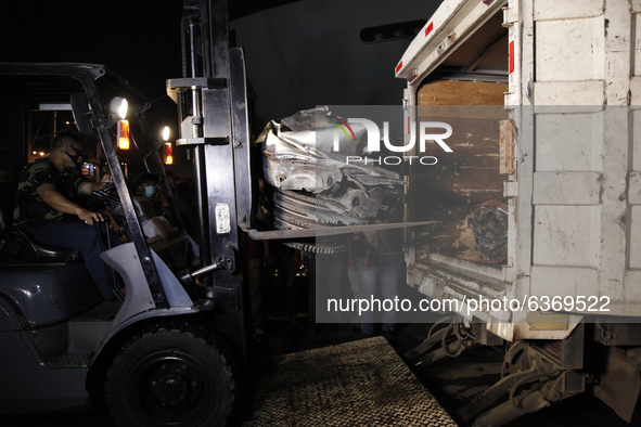 Joint SAR officers load the wreckages of crashed Sriwijaya Air flight SJ182 into the truck to be transport to National Transportation Safety...