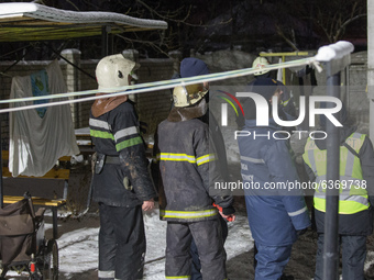 Firefighters near the house, in Kharkiv, Ukraine, on January 21, 2021.  A fire at a private nursing home in the Ukrainian city of Kharkiv ki...