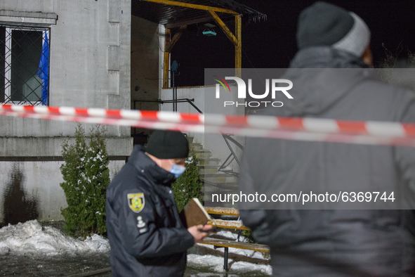 Police at the scene of the fire, in Kharkiv, Ukraine, on January 21, 2021.  A fire at a private nursing home in the Ukrainian city of Kharki...