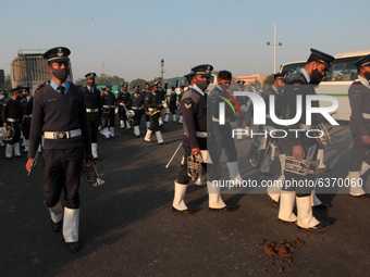 Indian Air Force personnel board buses after the Beating Retreat ceremony rehearsals ahead of the Republic Day parade, at Raisina Hills on J...