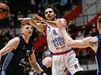 Shane Larkin (C) of Anadolu Efes passes the ball during the EuroLeague Basketball match between Zenit St. Petersburg and Anadolu Efes Istanb...