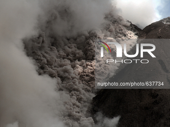 Clumps of pyroclastic flows of Mount Sinabung release into the air that comes out of the crater following the latest eruption after followin...