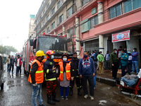 Bangladeshi firefighters seen searching after a devastating fire that broke out in a olio apparels garments in Dhaka, Bangladesh, January 24...