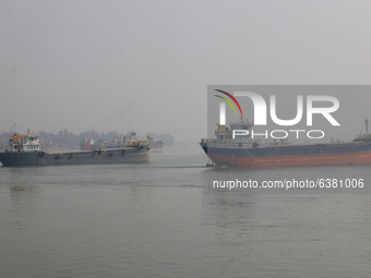  A cargo ship carrying containers  are seen covered in thick smog in Near of Kolkata City on January 25.2021.  (
