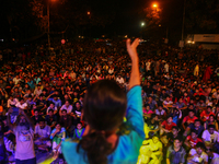 A feminist is spreading the message to unite against sexual violence at a concert in Dhaka, Bangladesh, 14 June 2015. (