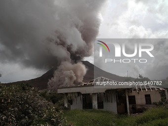 
An image available on June 14, 2015, which shows destroyed houses on the sidelines of Mount Sinabung issued a pyroclastic flow into the ai...
