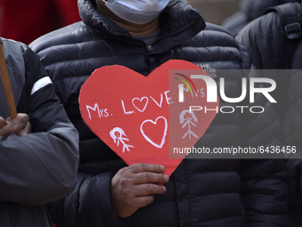 Nepalese people hold placard along with love slogans during Valentine’s Day program in Patan Durbar Square, Lalitpur, Nepal on Sunday, Febru...