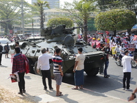 Myanmar protesters gather in front of armoured vehicles as they take part in a demonstration against the military coup outside the Central B...