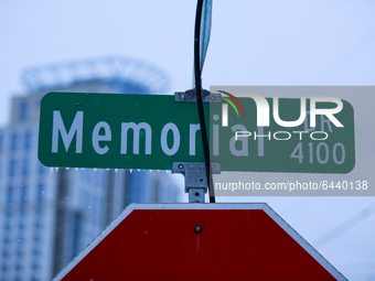A frozen street sign near Buffalo Bayou Park in Houston, Texas early on the morning of Monday, February 15th after the snow storm.  (