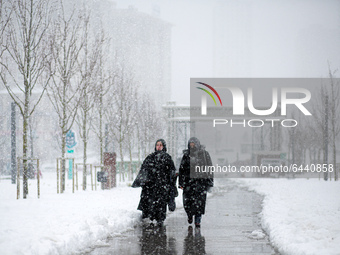 Turkish people have a walk in the snowy streets of Istanbul, Turkey on February 15, 2021 during heavy snowfalls. (