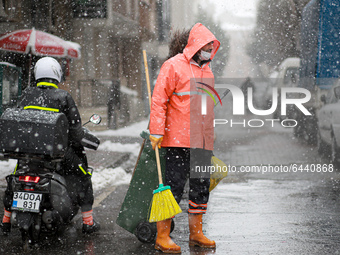 Turkish people have a walk in the snowy streets of Istanbul, Turkey on February 15, 2021 during heavy snowfalls. (