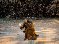 People are playing with the snow in Athens, Greece, on February 15, 2021. The snowfall called 'Medea' showed up in the area of Zografou in A...