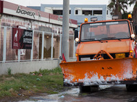 A  snow plow is at the side of the road ready  to meddle in the roads to remove snow from the streets in February 15, 2021.Athens turned int...