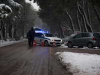 Police officers stop the traffic to the mountains due to the heavy snowfall in February 15, 2021.Athens turned into snow-globe scene, as cit...