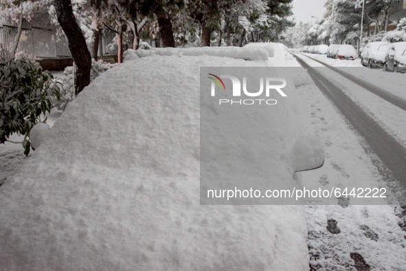 A snow covered car in the area of Zografou in Athens, Greece on February 16, 2021. The snowfall called 'Medea' showed up in Greece. 