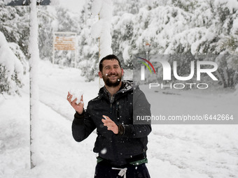 People are playing with the snow in Athens, Greece, on February 16, 2021. The snowfall called 'Medea' showed up in the area of Zografou in A...