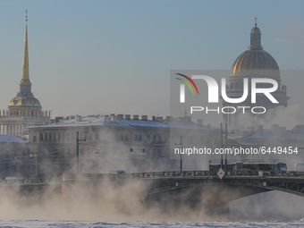 The Admiralty building and St. Isaac's Cathedral during a fog on the frozen Neva River in St. Petersburg, Russia, on February 18, 2021.  The...