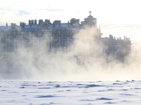 A woman walks past fog on the frozen Neva River in St. Petersburg. The air temperature dropped to -27 degrees.  (