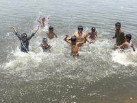 KARACHI, PAKISTAN, JUN 18: Children bathing into sea water to beat the heat of scorching sun, at China Creek in Karachi on Thursday, June 18...