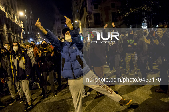 People take part in a demonstration against the imprisonment of rapper Pablo Hasel, in Barcelona, Spain, on February 19, 2021. Violent stree...