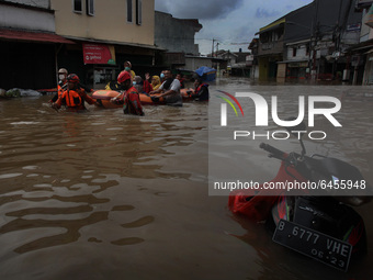 Rescuers evacuate residents affected by flooding in the Ciledug area, which is located south of the capital Jakarta, Indonesia, on February...
