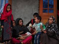 Wife of Abdul Wahid along with her 4 Kids outside their house in Sultan Daki, Uri Baramulla on 21 February 2021.  
On February 7, fire brok...