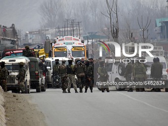 Indian soldiers are seen after an Improvised Explosive Device (IED) was diffused at Patha Chowk-Nowgam road in Srinagar,Kashmir on February...