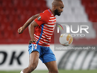 Dimitri Foulquier of Granada controls the ball during the UEFA Europa League Round of 32 match between Granada CF and SSC Napoli at Estadio...