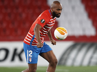 Dimitri Foulquier of Granada controls the ball during the UEFA Europa League Round of 32 match between Granada CF and SSC Napoli at Estadio...