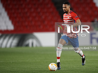 Kenedy of Granada runs with the ball during the UEFA Europa League Round of 32 match between Granada CF and SSC Napoli at Estadio Nuevo los...