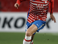 Jorge Molina of Granada runs with the ball during the UEFA Europa League Round of 32 match between Granada CF and SSC Napoli at Estadio Nuev...