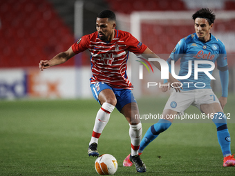 Yangel Herrera of Granada and Eljif Elmas of Napoli compete for the ball during the UEFA Europa League Round of 32 match between Granada CF...
