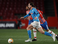 Fabian Ruiz of Napoli runs with the ball during the UEFA Europa League Round of 32 match between Granada CF and SSC Napoli at Estadio Nuevo...