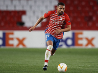 Yangel Herrera of Granada runs with the ball during the UEFA Europa League Round of 32 match between Granada CF and SSC Napoli at Estadio Nu...