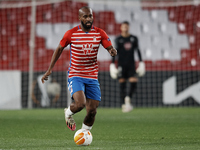 Dimitri Foulquier of Granada in action during the UEFA Europa League Round of 32 match between Granada CF and SSC Napoli at Estadio Nuevo lo...