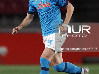 Amir Rrahmani of Napoli runs with the ball during the UEFA Europa League Round of 32 match between Granada CF and SSC Napoli at Estadio Nuev...
