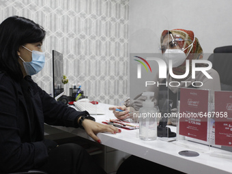 A woman consulted with a doctor during a beauty treatment at an aesthetic clinic in the Bogor city,  Indonesia on February 24, 2021. The bea...