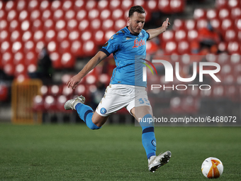 Amir Rrahmani of Napoli shooting to goal during the UEFA Europa League Round of 32 match between Granada CF and SSC Napoli at Estadio Nuevo...
