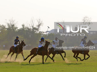 Players of Sona Polo and Chandna Group teams in action during the 'Rajmata Gayatri Devi Memorial Cup' polo match at Polo ground in Jaipur,Ra...