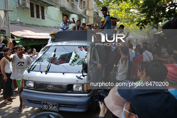 Pro-military supporters detained by residents are transferred after a clash in Yangon, Myanmar on February 25, 2021. 