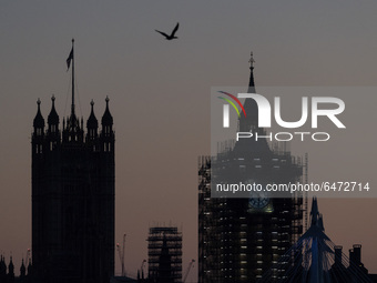 LONDON, UNITED KINGDOM - FEBRUARY 26, 2021: A view of the Victoria Tower and Big Ben during sunset after a warm and clear spring day in Lond...